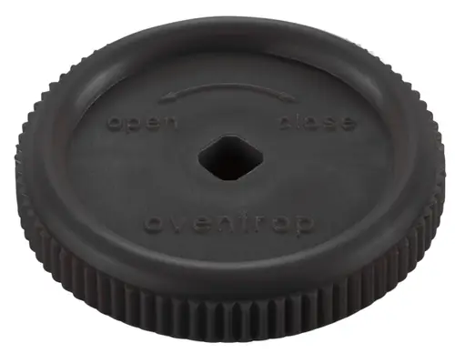Schwarzes Handrad mit umlaufender Riffelung und einem hexagonalen Loch in der Mitte, beschriftet mit "open", "close" und "oventrop".
